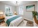 Serene main bedroom with hardwood floors, a cozy rug, and a soothing color palette at 330 17Th Nw St, Hickory, NC 28601