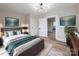 Stylishly staged main bedroom features a plush bed, soft rug, and modern decor at 330 17Th Nw St, Hickory, NC 28601