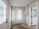 Bright mud room featuring plank flooring, a window, and white trim for added charm at 330 17Th Nw St, Hickory, NC 28601
