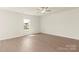 Inviting bedroom with natural light, neutral walls and flooring, creating a serene retreat at 3320 Burberry Dr, Gastonia, NC 28052