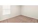 Bedroom with carpet flooring and window with blinds at 3320 Burberry Dr, Gastonia, NC 28052