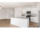 Modern kitchen with white cabinets, granite countertops and stainless-steel appliances at 3320 Burberry Dr, Gastonia, NC 28052