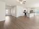 Bright open-concept living space featuring hardwood floors, modern lighting and a sleek kitchen at 3320 Burberry Dr, Gastonia, NC 28052
