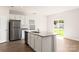 Bright kitchen featuring stainless steel appliances, white cabinets, and gray countertops at 3331 Burberry Dr, Gastonia, NC 28052