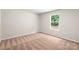Bedroom with neutral carpeting and a window showing lots of natural light at 3334 Strong Box Ln, Gastonia, NC 28052
