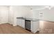 Bright kitchen with white cabinets, granite counters, and stainless steel dishwasher at 3334 Strong Box Ln, Gastonia, NC 28052