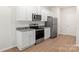 Stylish kitchen with granite countertops, stainless appliances, and wood flooring at 3334 Strong Box Ln, Gastonia, NC 28052