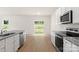 Bright and airy kitchen with granite countertops, stainless appliances, and ample storage at 3334 Strong Box Ln, Gastonia, NC 28052