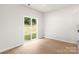 Bright living area with wood floors and sliding glass doors leading to the backyard at 3334 Strong Box Ln, Gastonia, NC 28052