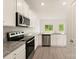 Bright kitchen with stainless steel appliances, granite countertops, and stylish cabinetry at 3342 Strong Box Ln, Gastonia, NC 28052