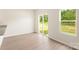 Living area with vinyl floors open to the kitchen, flooded with natural light through sliding glass doors at 3342 Strong Box Ln, Gastonia, NC 28052