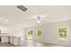 Open concept living room with kitchen, sliding glass doors to backyard, and lots of natural light at 3342 Strong Box Ln, Gastonia, NC 28052
