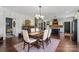 Elegant dining room with hardwood floors and a view of the kitchen at 355 Cal Kennedy Rd, Cleveland, NC 27013