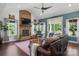 Comfortable living room with brick fireplace and lots of natural light at 355 Cal Kennedy Rd, Cleveland, NC 27013