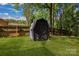 Outdoor storage shed in a fenced backyard, offering practicality and privacy at 3637 Glenville Rd, Charlotte, NC 28215
