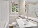 Bright bathroom with a window, offering natural light, and classic fixtures at 3637 Glenville Rd, Charlotte, NC 28215