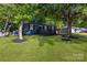 Charming home with a welcoming front porch and well-manicured lawn at 3637 Glenville Rd, Charlotte, NC 28215