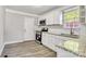 Modern kitchen features white cabinets, granite countertops, and stainless steel appliances at 3637 Glenville Rd, Charlotte, NC 28215