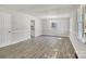 Bright, open living room featuring neutral paint and modern flooring at 3637 Glenville Rd, Charlotte, NC 28215