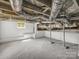 Unfinished basement with painted walls and exposed ceiling features at 411 W Sycamore St, Lincolnton, NC 28092