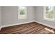 Bedroom featuring two windows and light grey paint at 411 W Sycamore St, Lincolnton, NC 28092