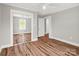 Bedroom with hardwood floors and a mirrored closet at 411 W Sycamore St, Lincolnton, NC 28092