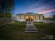 Charming home featuring a manicured lawn and a welcoming front porch at 411 W Sycamore St, Lincolnton, NC 28092