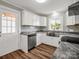 Updated kitchen featuring granite countertops, stainless steel appliances, and modern finishes at 411 W Sycamore St, Lincolnton, NC 28092