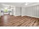 Open-concept living space with new flooring, seamlessly connecting the living room and kitchen at 411 W Sycamore St, Lincolnton, NC 28092