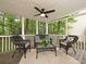Relaxing covered back porch, featuring a ceiling fan and stylish wicker furniture at 4315 Poplar Grove Dr, Charlotte, NC 28269