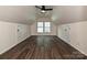 Spacious bonus room with dormer windows, hardwood floors, neutral walls and ceiling fan at 4315 Poplar Grove Dr, Charlotte, NC 28269
