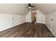 Spacious bonus room featuring modern ceiling fan and a beautiful dark wood-look floors at 4315 Poplar Grove Dr, Charlotte, NC 28269