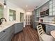 Open kitchen design with gray cabinetry, stainless steel appliances, quartz countertops, and hardwood floors at 4315 Poplar Grove Dr, Charlotte, NC 28269