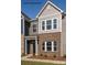 New townhome with brick and gray wood-look exterior and inviting front entrance at 483 Shasta St # 5202, Gastonia, NC 28052