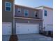 Attached two-car garage, featuring a white door and modern exterior with clean lines at 483 Shasta St # 5202, Gastonia, NC 28052
