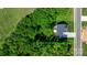 An aerial view shows the house is surrounded by lush trees and a well-maintained lawn at 4941 Southview Dr, Hickory, NC 28602