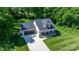 Aerial view showcases home with a spacious yard, front porch, and attached garage at 4941 Southview Dr, Hickory, NC 28602