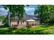 Beautiful backyard featuring a wooden deck, gazebo, and mature trees for shade and privacy at 4941 Southview Dr, Hickory, NC 28602
