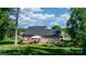 Wide shot of a well-maintained backyard featuring a gazebo, deck, and lush greenery at 4941 Southview Dr, Hickory, NC 28602
