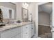 Bathroom featuring double sinks, granite countertops, and views to the bedroom at 4941 Southview Dr, Hickory, NC 28602