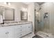 Modern bathroom with double vanity, granite countertops, and a glass-enclosed shower at 4941 Southview Dr, Hickory, NC 28602