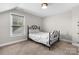Bedroom with a large window and a black decorative metal bed frame at 4941 Southview Dr, Hickory, NC 28602