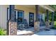 Inviting front porch featuring classic rocking chairs and brick-based support columns at 4941 Southview Dr, Hickory, NC 28602