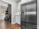 View of the kitchen, stainless steel refrigerator, white cabinets, and entry to laundry room at 4941 Southview Dr, Hickory, NC 28602