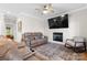Comfortable living room featuring a fireplace, ceiling fan and seating area at 4941 Southview Dr, Hickory, NC 28602