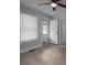 Light-filled bedroom with neutral walls, light vinyl flooring, and an open doorway at 520 E Maple Ave, Gastonia, NC 28054