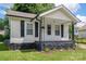 Charming single-story home featuring a cozy front porch and well-maintained landscaping at 520 E Maple Ave, Gastonia, NC 28054