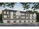 New townhome featuring a gray exterior, front doors, and one car garages in a well-manicured community at 534 Beatties Ford Rd, Charlotte, NC 28216