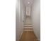 Bright white staircase with wood treads, creating a clean and modern transition between floors at 534 Beatties Ford Rd, Charlotte, NC 28216