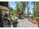 Inviting back patio with a dining area, lounge seating, and stunning lake views at 570 Blue Heron Rd, Salisbury, NC 28146